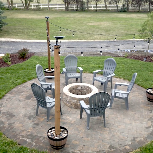 Arial view of paver and fire pit installation project, with outdoor lightning, in Rexburg